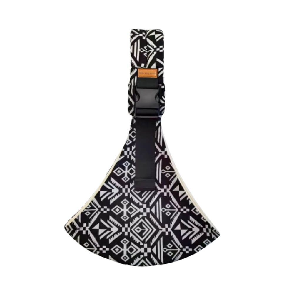 Porte-bébé Monreux Snugli tribal noir et blanc à motifs ethniques géométriques.